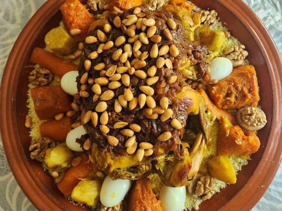 Moroccan couscous with chicken, caramelized onions, almonds and vegetables