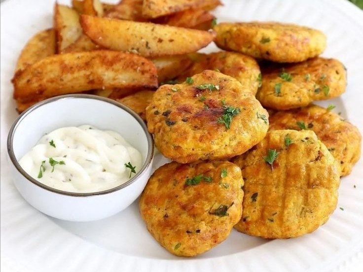 Golden Moroccan maakouda potato patties with fries and a dip