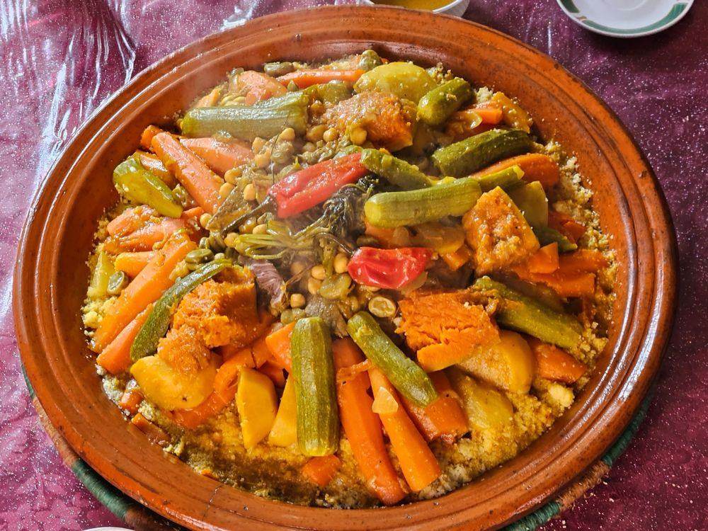 Moroccan couscous with seven vegetables served in a clay dish